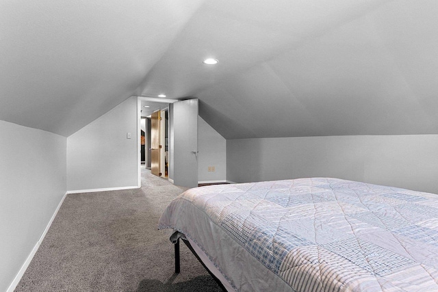 carpeted bedroom featuring vaulted ceiling