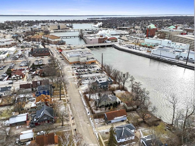 birds eye view of property with a water view