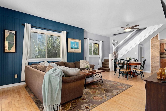 living room featuring hardwood / wood-style floors, a wealth of natural light, and ceiling fan