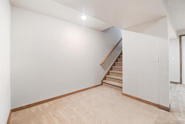 basement with light colored carpet