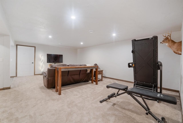 exercise room with light colored carpet