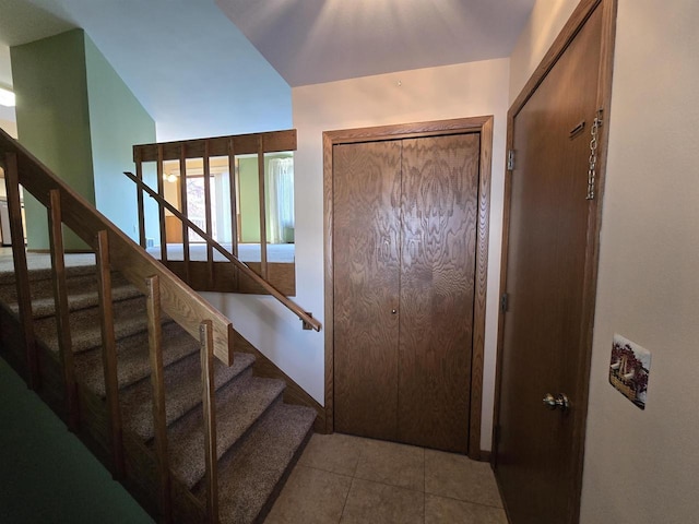 entrance foyer featuring light tile patterned flooring