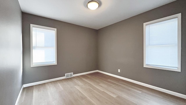 empty room featuring light hardwood / wood-style floors