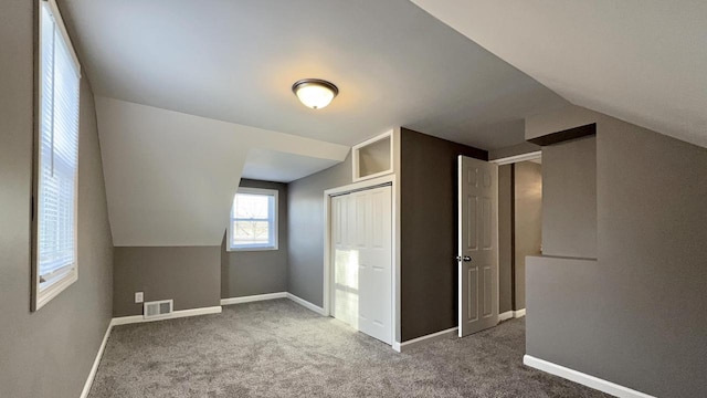 bonus room featuring carpet and lofted ceiling