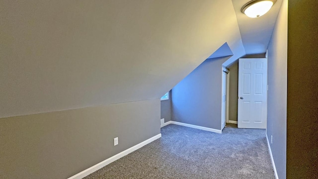 bonus room with carpet flooring and lofted ceiling