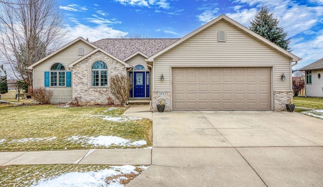 single story home featuring a front yard and a garage