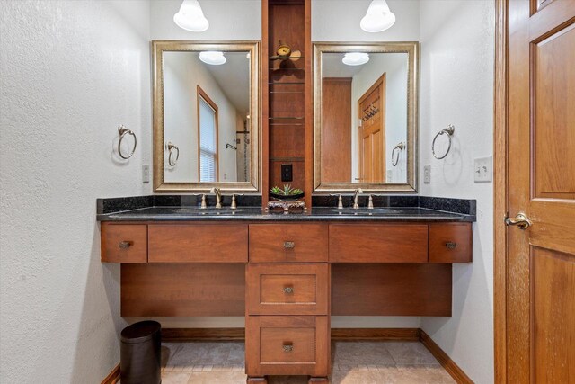 bathroom with tile patterned floors and vanity