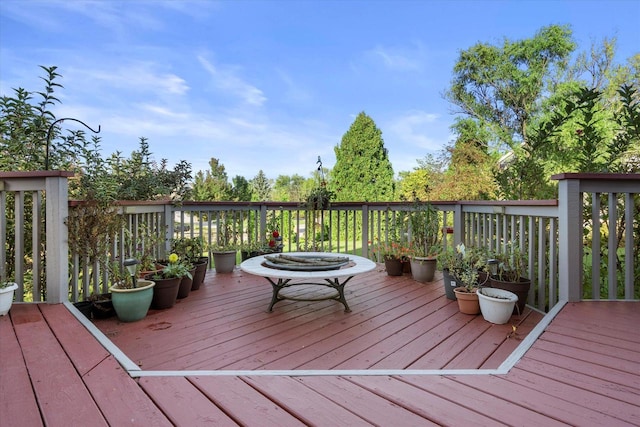 deck with an outdoor fire pit