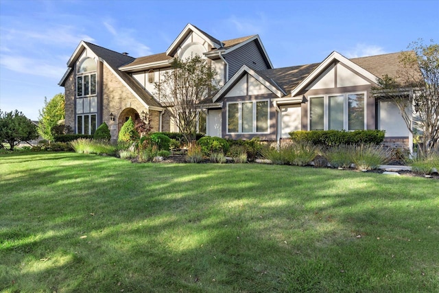 tudor home with a front yard