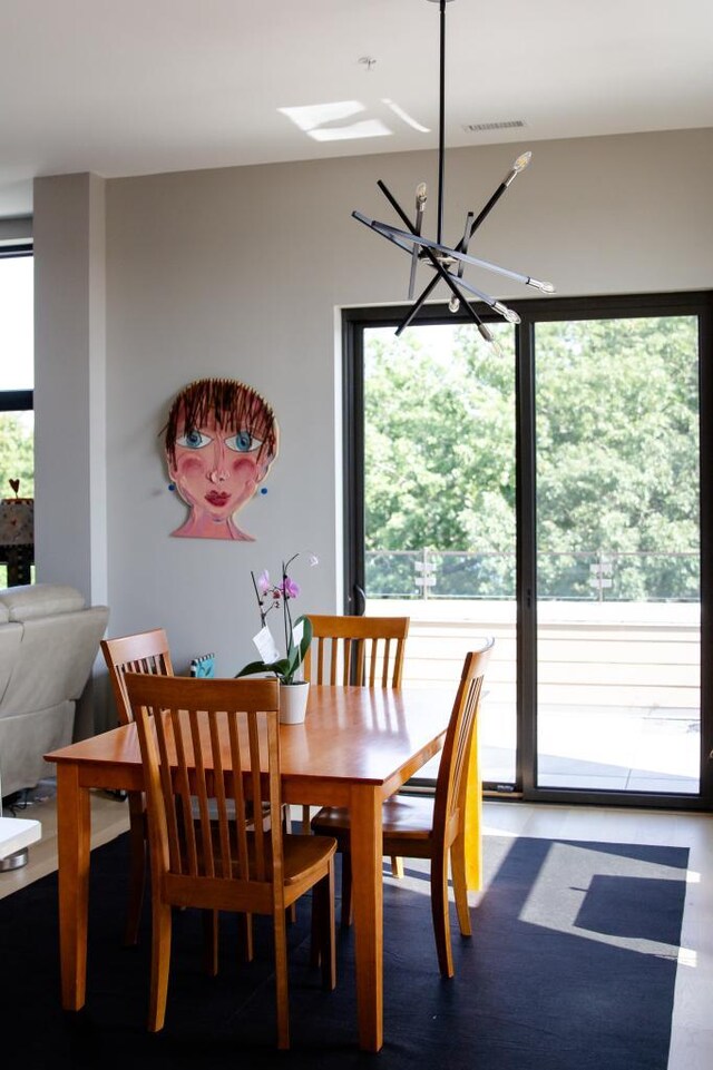 dining room with a notable chandelier