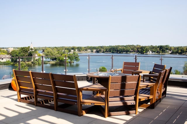 exterior space with a water view and a balcony