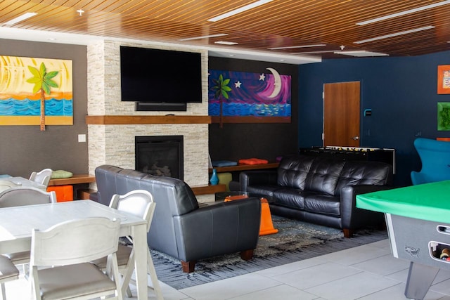 interior space with wooden ceiling, a fireplace, and light tile patterned floors