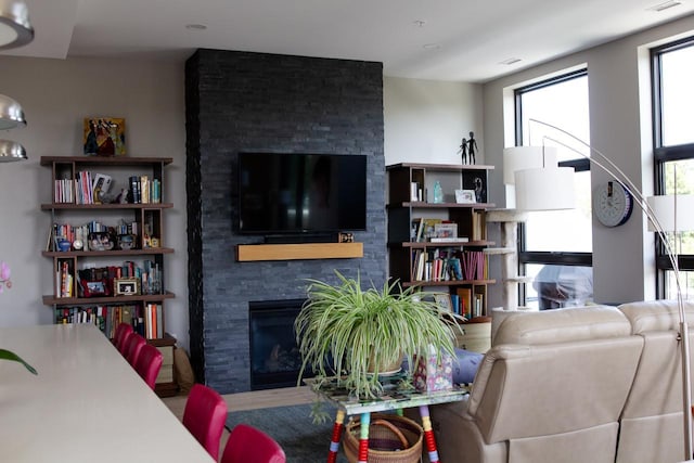 living room featuring a fireplace