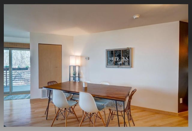 dining room featuring light hardwood / wood-style floors