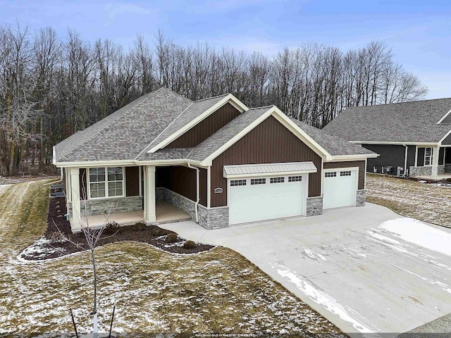 view of front of house featuring covered porch and a garage