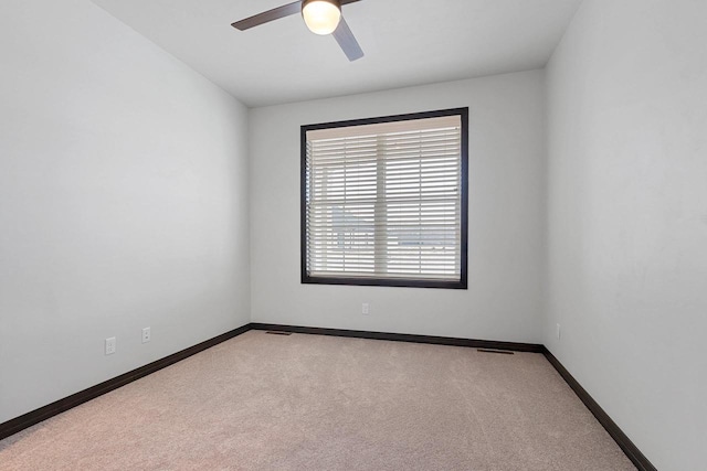 carpeted empty room with ceiling fan