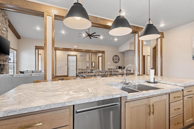 kitchen featuring lofted ceiling with beams, sink, hanging light fixtures, and light brown cabinets