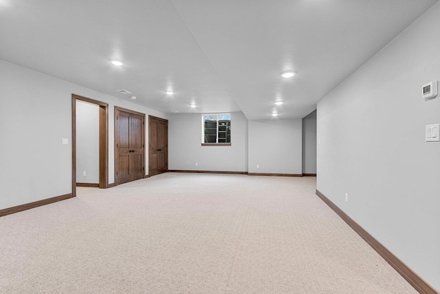 basement with light colored carpet