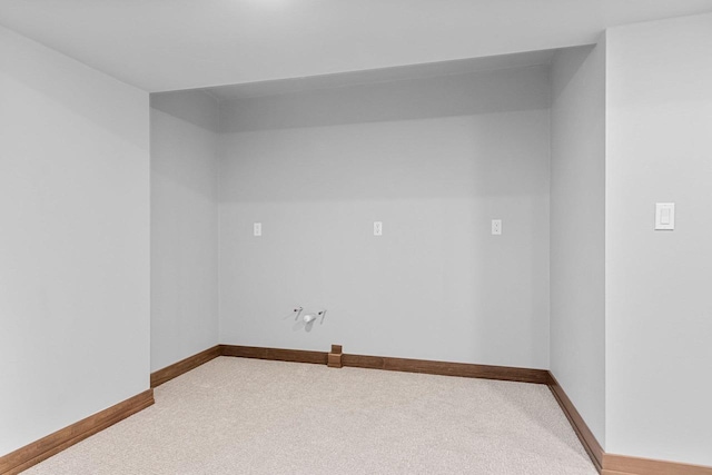 spare room featuring light colored carpet