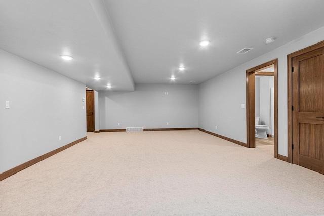 unfurnished room with light colored carpet