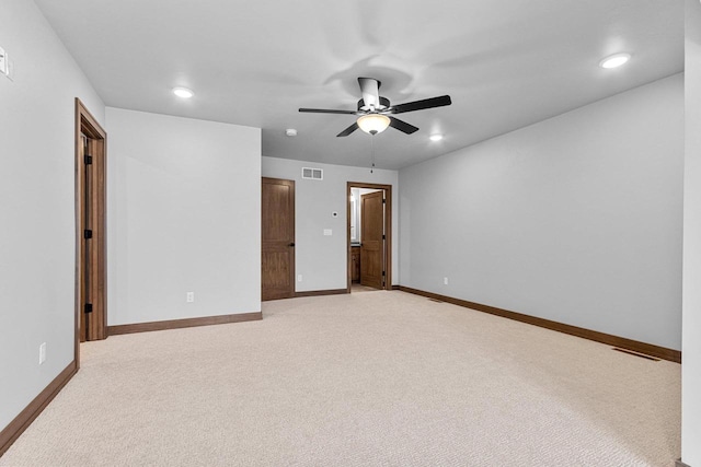 unfurnished bedroom with ceiling fan and light colored carpet