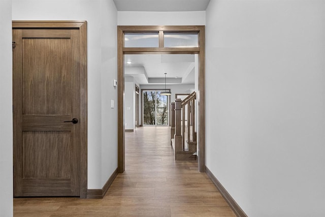 hall with light wood-type flooring