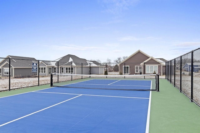 view of sport court with basketball hoop