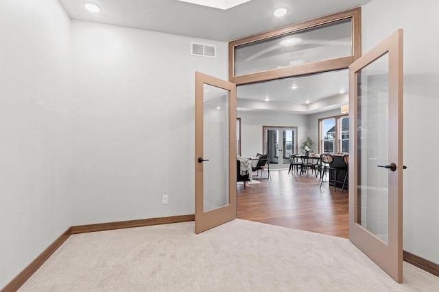 interior space featuring carpet flooring and french doors