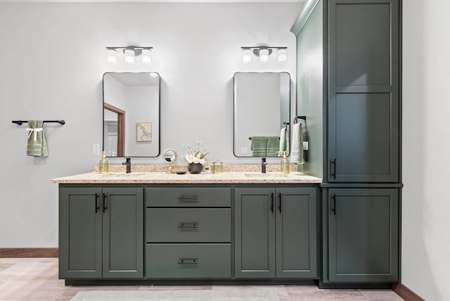 bathroom with tile patterned flooring and vanity