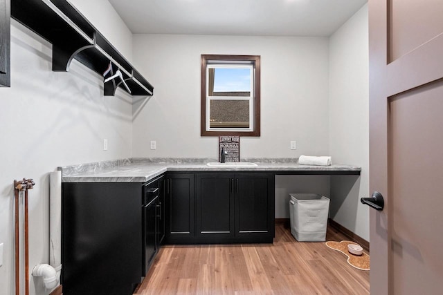 interior space with light hardwood / wood-style floors and sink