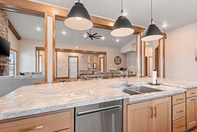 kitchen with light brown cabinetry, lofted ceiling with beams, hanging light fixtures, and sink