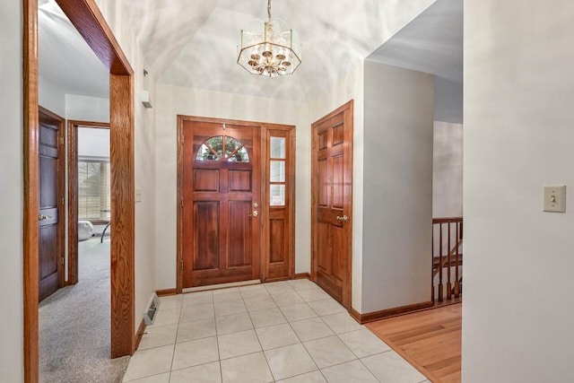 entrance foyer featuring a notable chandelier and light tile patterned floors