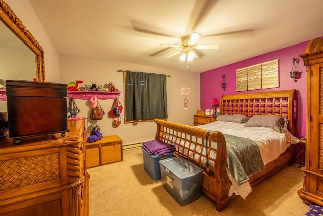 carpeted bedroom featuring baseboard heating and ceiling fan