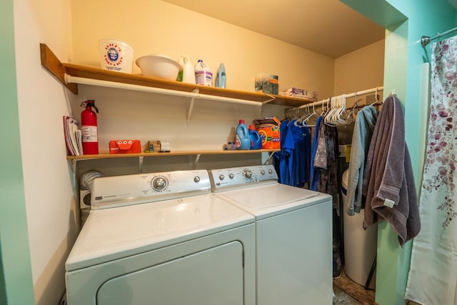 washroom with washer and dryer