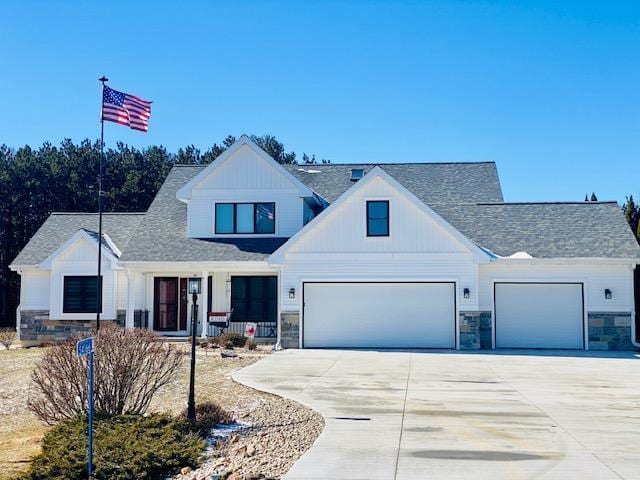 modern inspired farmhouse with a garage