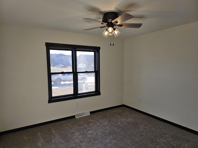 empty room with carpet flooring and ceiling fan