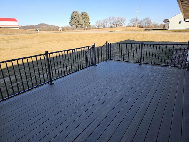 wooden terrace featuring a rural view