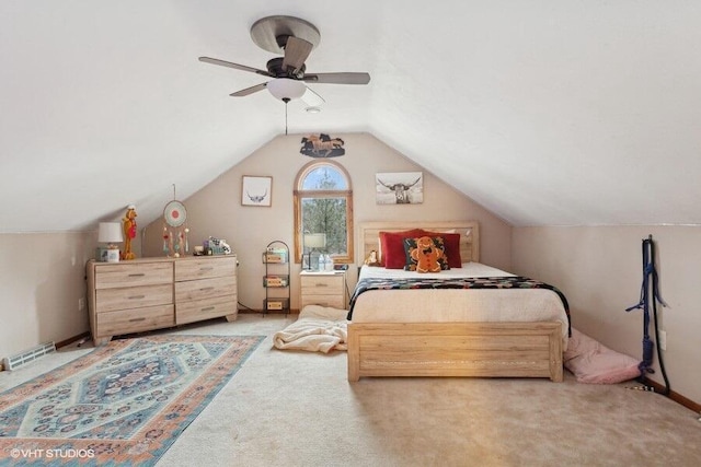 bedroom featuring ceiling fan, carpet flooring, and lofted ceiling