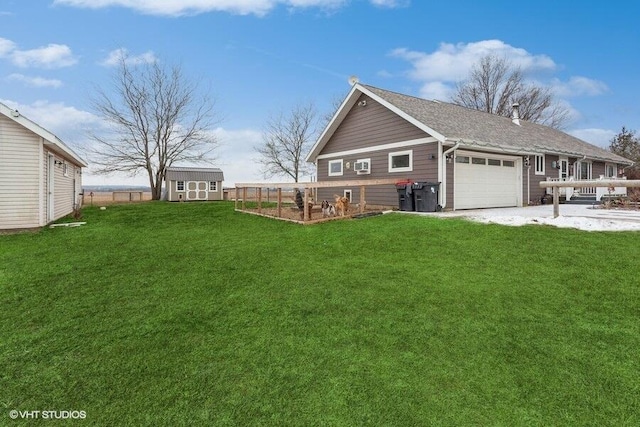 view of front of house with a front yard and a storage shed