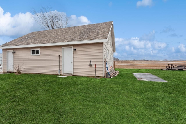 view of outdoor structure with a lawn