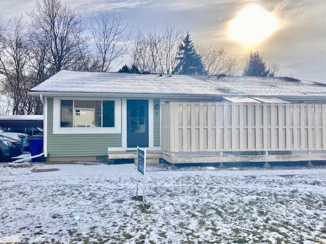 view of front of home featuring a carport