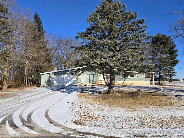 view of property hidden behind natural elements