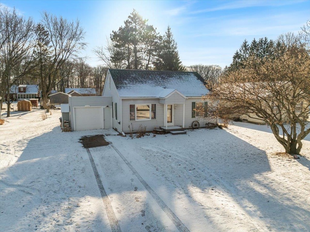 view of front of house with an outdoor structure and a garage