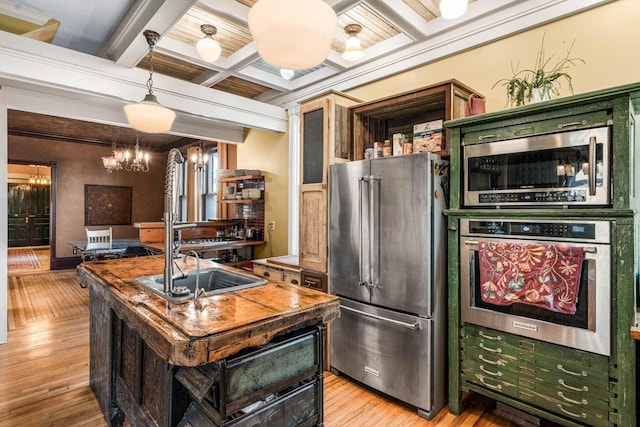 kitchen with stainless steel appliances, a center island, light wood-type flooring, coffered ceiling, and beam ceiling