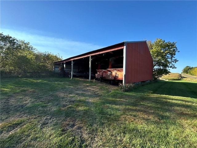 view of outdoor structure featuring a lawn