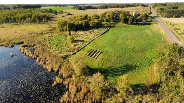 drone / aerial view featuring a rural view and a water view