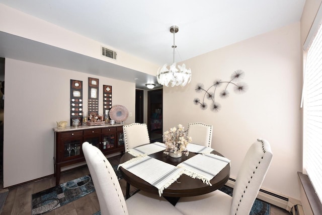 dining area featuring a chandelier and hardwood / wood-style floors