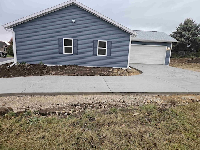 view of property exterior featuring a garage