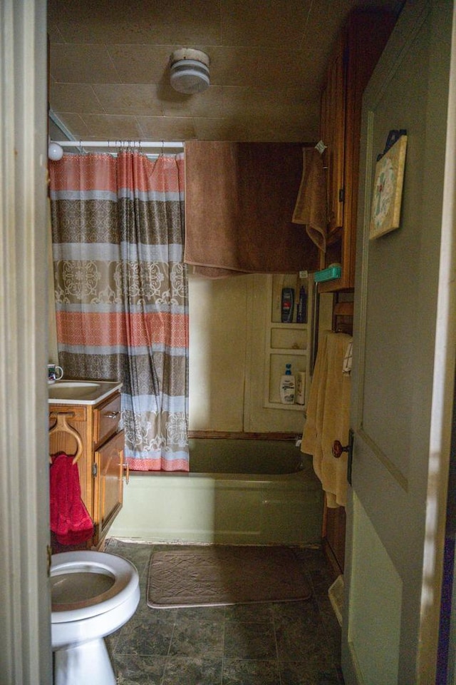 full bathroom with vanity, toilet, and shower / bath combo with shower curtain