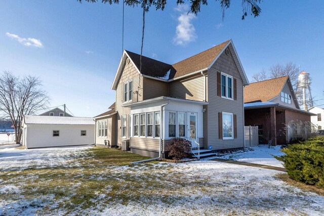 616 Elk St, Sabula, IA 52070 - view of snowy exterior featuring central AC unit
